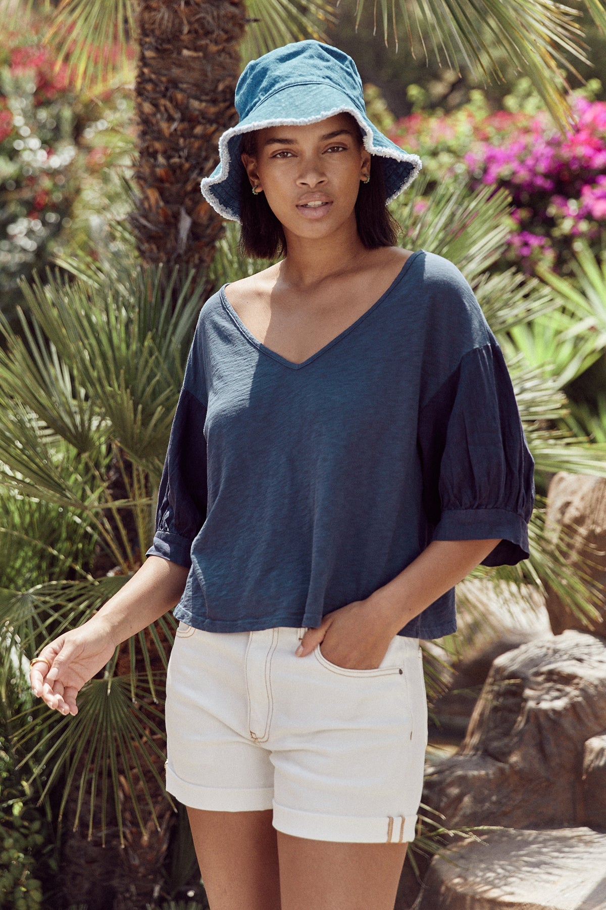 Claudia puff sleeve tee in navy with Natalie shorts in ecru and denim fringed bucket hat.-25275521204420