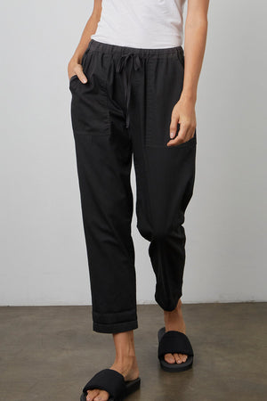 MIsty cotton twill pant in onyx black front with model's hand in pocket.