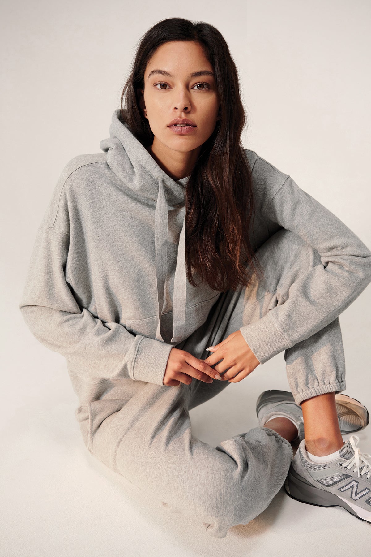 a model wearing ZUMA SWEATPANT by Velvet by Jenny Graham and sneakers.-27196430876868