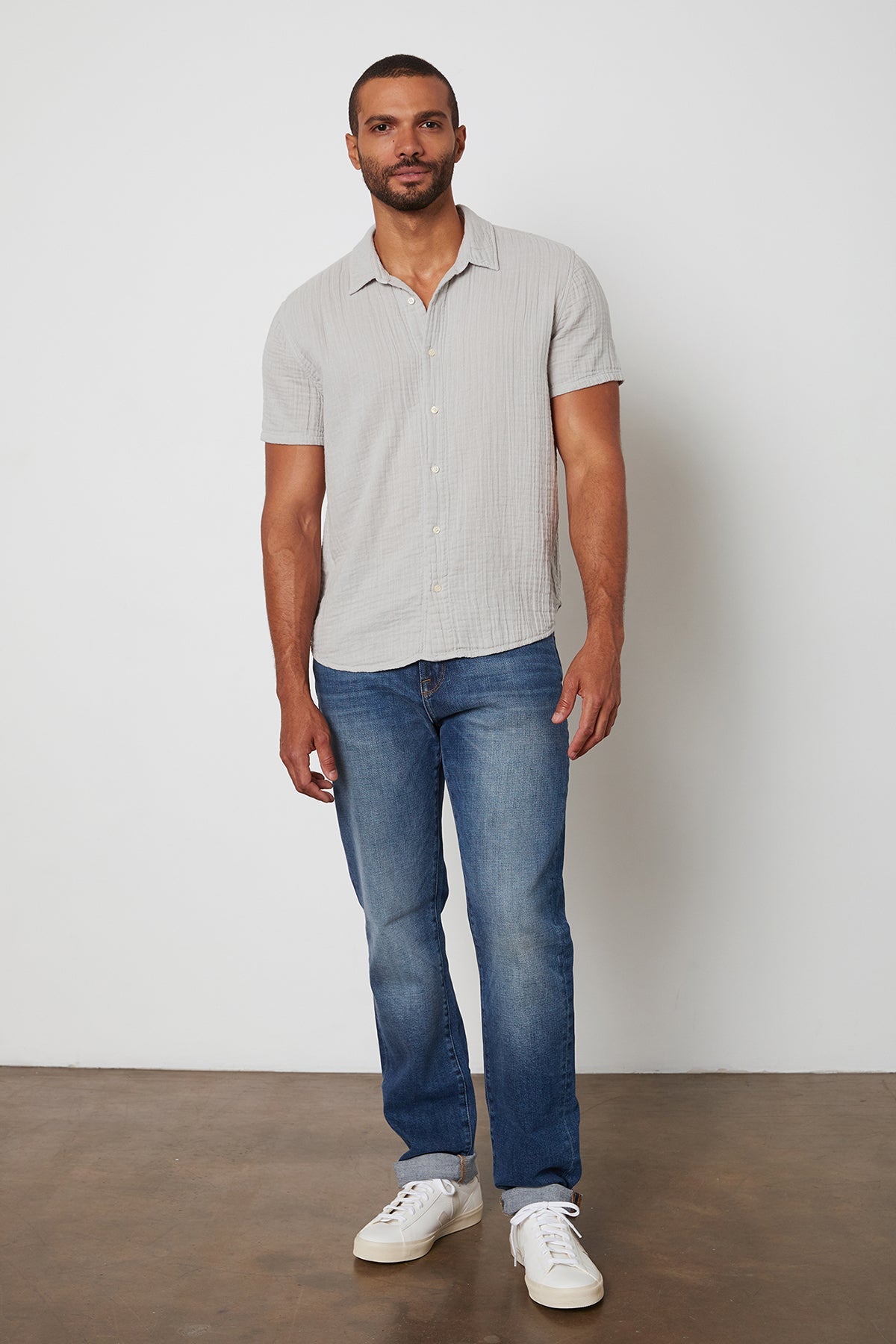 Cotton gauze Christian button up shirt in light grey and blue jeans.-25275504033988